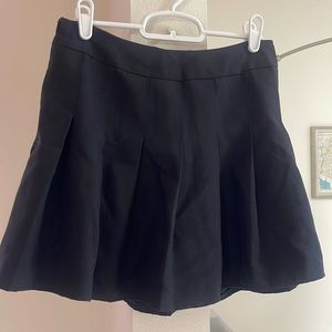Black pleated miniskirt